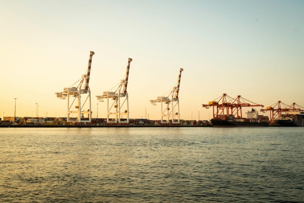 Sunset view of cranes and container ships at Fremantle Port, Western Australia.